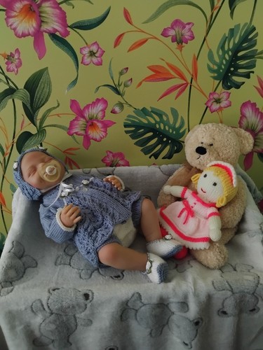 Hand knitted baby reborn doll